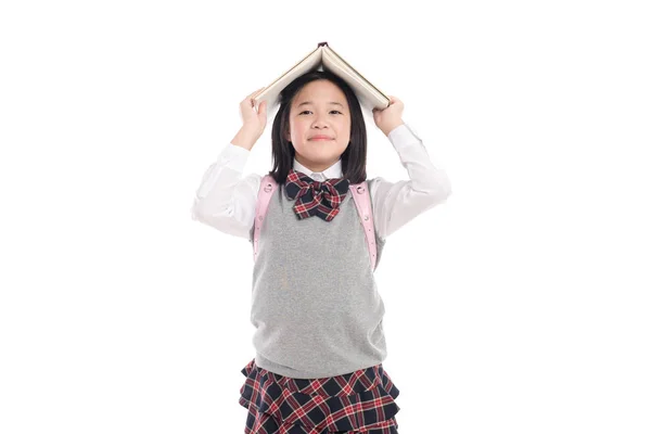 Ασιατικές κορίτσι με βιβλίο στο κεφάλι — Φωτογραφία Αρχείου