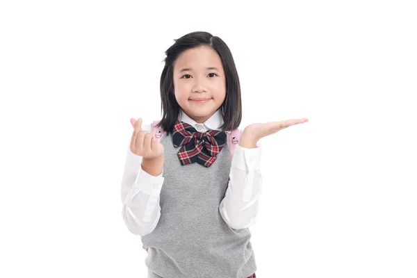 Asiatische Studentin zeigt auf offene Handfläche — Stockfoto