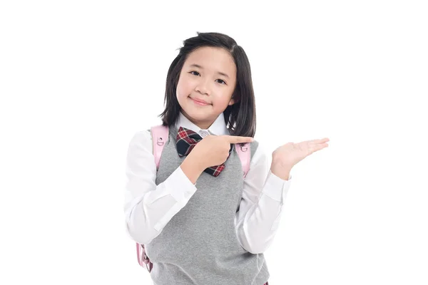 Asiatische Studentin zeigt auf offene Handfläche — Stockfoto