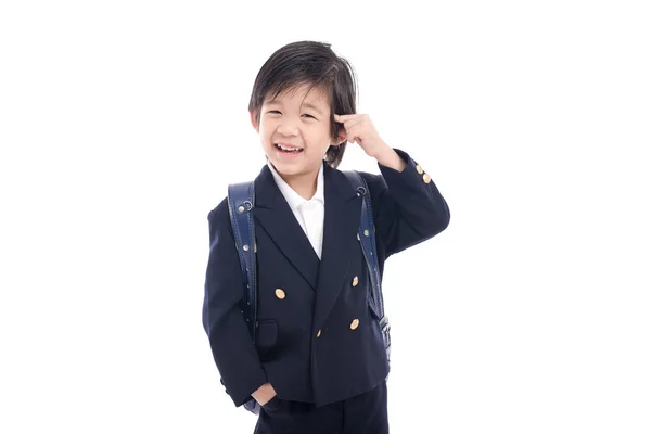 Ασιατικές παιδί στο σχολείο ομοιόμορφη με τις μπλε σχολική τσάντα — Φωτογραφία Αρχείου
