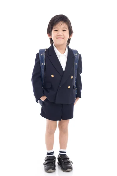 Asiatico bambino in uniforme scolastica con sacchetto blu scuola — Foto Stock