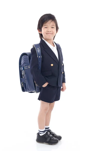 Niño asiático en uniforme escolar con bolso escolar azul —  Fotos de Stock