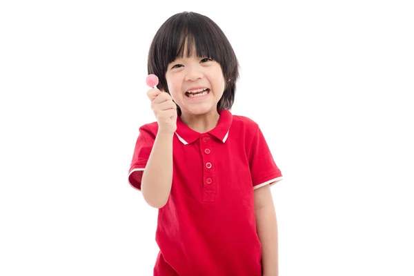 Aziatische kind een lolly eten op witte achtergrond — Stockfoto