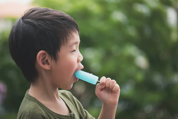 Asian child eating japanese ice cream — Stock Photo, Image