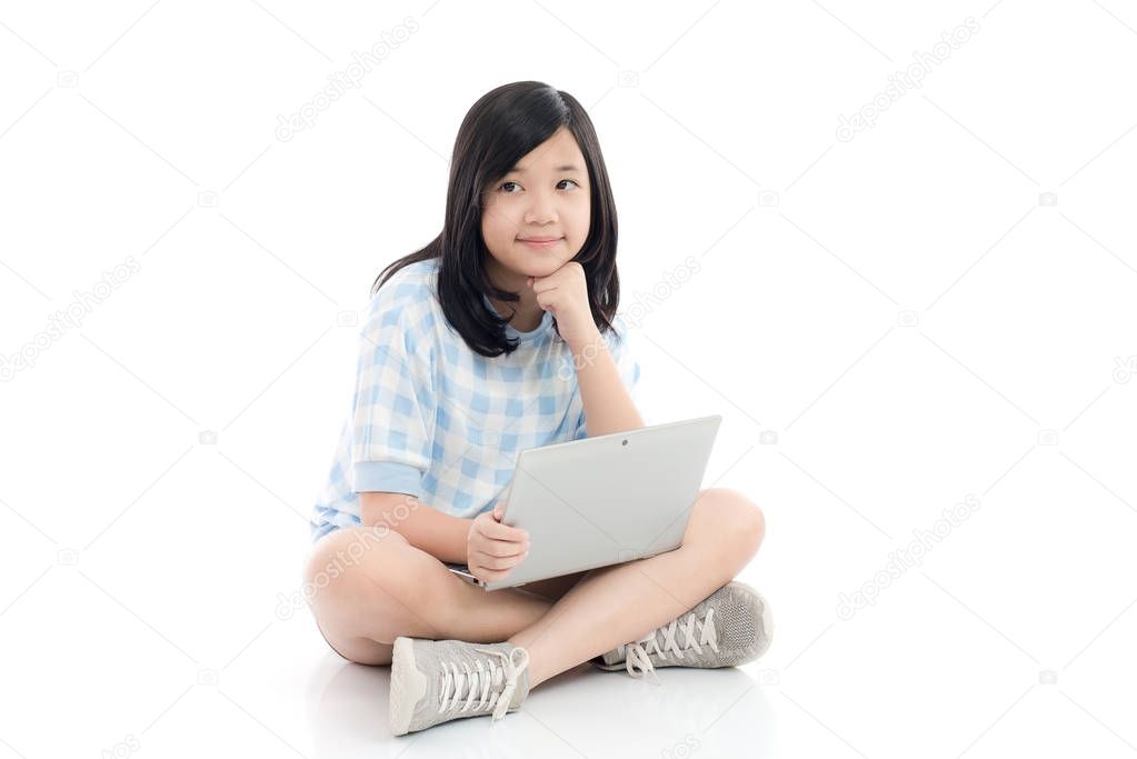 Happy Asian girl with laptop thinking, isolated on white background
