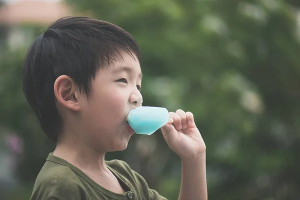 Cute Asian Child Eating Blue Ice Cream Outdoors — Stock Photo, Image