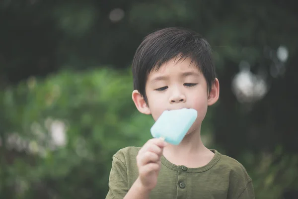 Cute Asian Child Eating Blue Ice Cream Outdoors — Stock Photo, Image