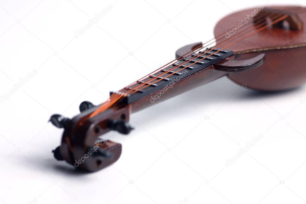 detail of rebab, arabic musical instrument, isolated on white background. Image contains copy space