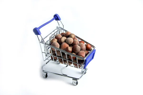 a shopping cart of filbert isolated on white background flat lay. Image contains copy space