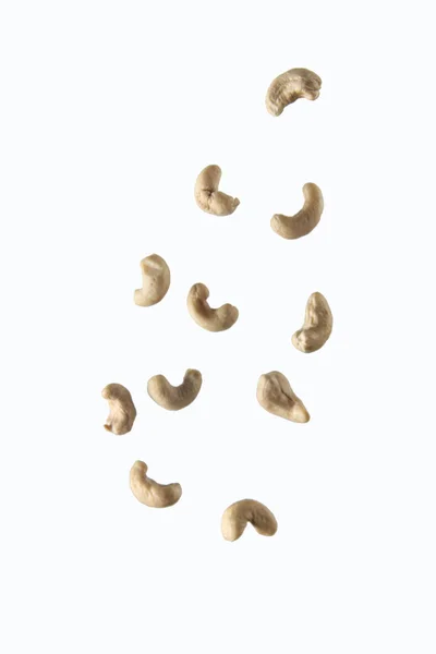 Hälla Cashew Mot Vit Bakgrund Begreppet Flygande Mat Bilden Innehåller — Stockfoto