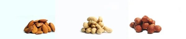 Drei Haufen Nüsse Haselnuss Mandel Cashew Isoliert Auf Weißem Hintergrund — Stockfoto