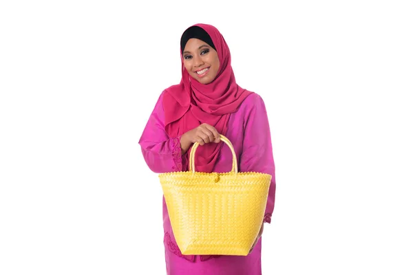 Beautiful asian muslimah woman with green wicker tote bags.Isolated — Stock Photo, Image