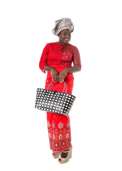 African woman in traditional clothing with tote bag.Isolated Royalty Free Stock Images
