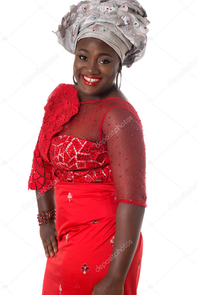Beautiful African lady in traditional red dress.Isolated