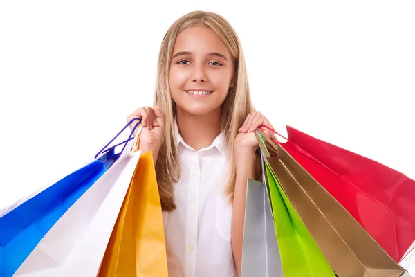 Szczęśliwy nastoletnie dziewczyny w odzieży casual z torby na zakupy, na białym tle — Zdjęcie stockowe