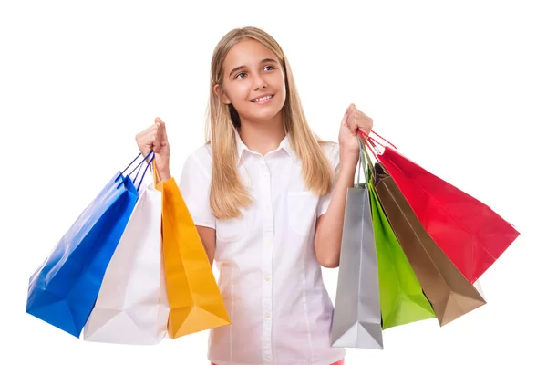 Happy lovely girl with shopping bags looking up, isolated — Stock Photo, Image