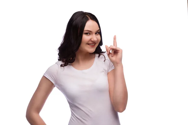 Esmer genç kadın işaret parmağı yukarıya, yalıtılmış — Stok fotoğraf