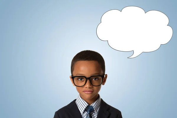 childhood and people concept-little african american boy with glasses in business suit over blue background with empty thought bubble