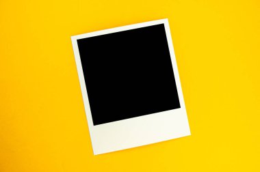 photo with the image of a black square lies on a yellow backgrou clipart
