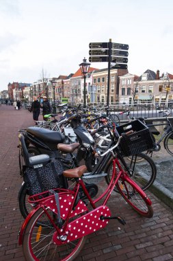 AMSTERDAM, NETHERLANDS - December 2019: Amsterdam canal. Amsterdam bicycle. Traditional cityscape of Amsterdam town, Netherlands