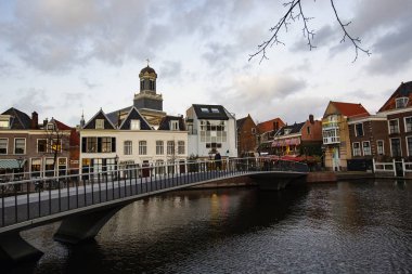 AMSTERDAM, NETHERLANDS - December 2019: Amsterdam cityscape. Amsterdam dutch houses with canal view, Netherlands
