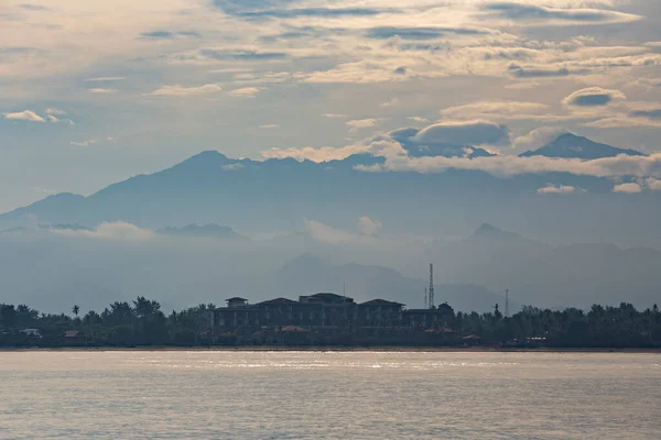 Beautiful morning sea view at Gili Air, Bali, Indonesia. Sea, mountains and clouds on the island, Bali, Indonesia