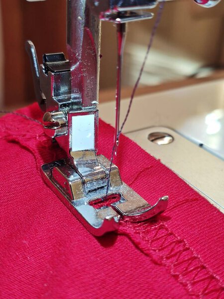 Modern sewing machine.Close-up shot of needle and thread of modern sewing machine.