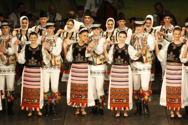 TIMISOARA, ROMANIA- 12. 10.2014 Romanian dancers in traditional costume, perform a folkore traditional dance.