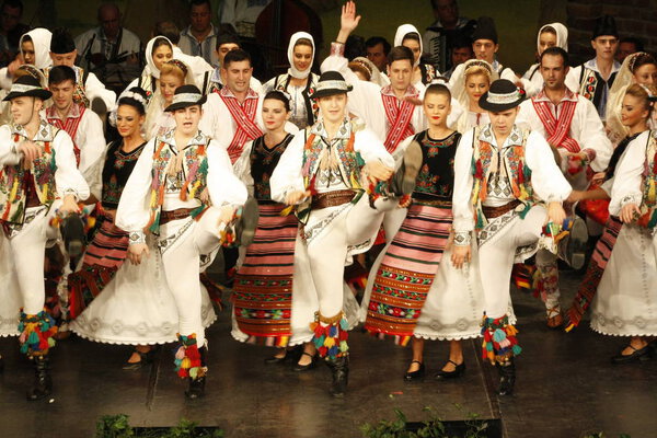 TIMISOARA, ROMANIA- 12. 10.2014 Romanian dancers in traditional costume, perform a folkore traditional dance.