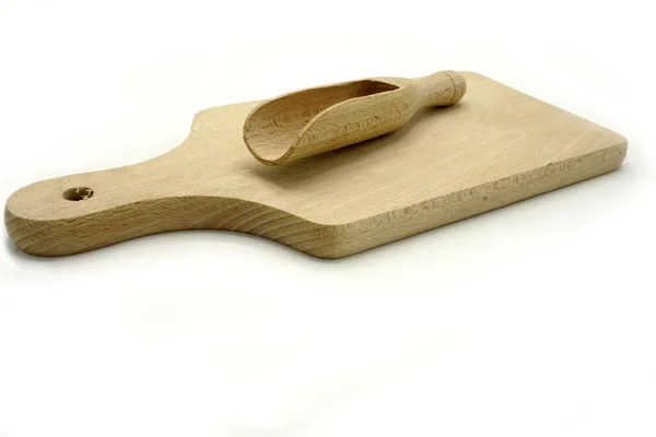 Wooden kitchen utensils on white background. Cutting board and scoop. — 스톡 사진