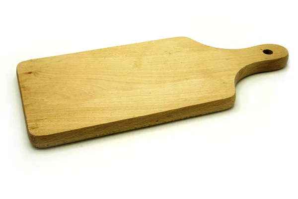 Drewniane naczynia kuchenne na białym tle. Płyta do cięcia ręcznego. — Zdjęcie stockowe