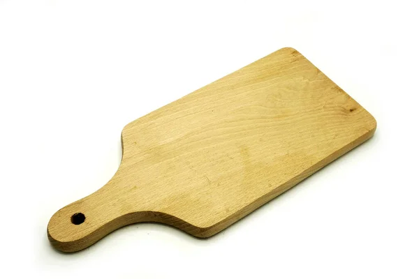 Drewniane naczynia kuchenne na białym tle. Płyta do cięcia ręcznego. — Zdjęcie stockowe
