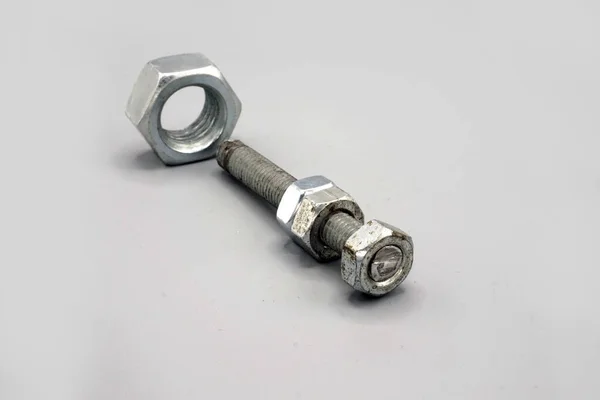 Stainless Steel Screws Nuts Isolated Gray Background New Shiny Chrome — ストック写真