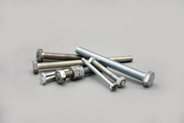 Stainless Steel Screws Nuts Isolated Gray Background New Shiny Chrome — ストック写真