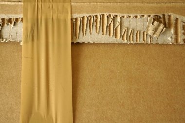 Arkaplanı bant olan kahverengi karton çarşaflar. Paketleme malzemelerinin ayrıntıları.