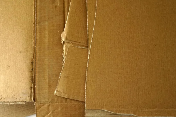 Sheets of brown corrugated cardboard stacked. Packaging material.