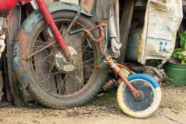 old wheels of a bike and a child bycicle