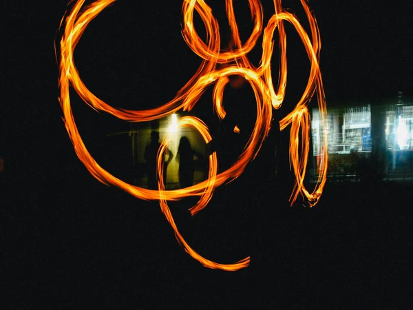 Fire torches during a fireshow artist\'s performance