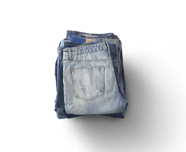 Verschiedene Jeans Liegen Auf Dem Hellen Boden — Stockfoto