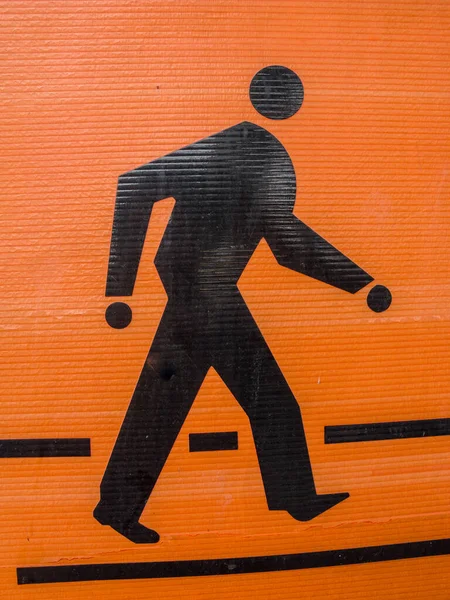 Das Orange Schwarze Fußgängersymbol — Stockfoto