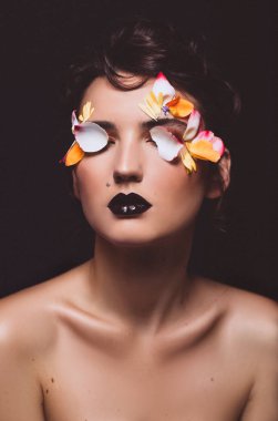 beauty woman on black with makeup and flower