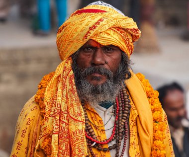 Varanasi, India - Dec 23, 2019: Sadhu at the ghats in Varanasi in India