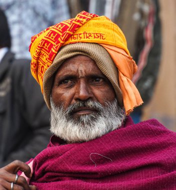 Varanasi, India - Dec 23, 2019: Sadhu at the ghats in Varanasi in India