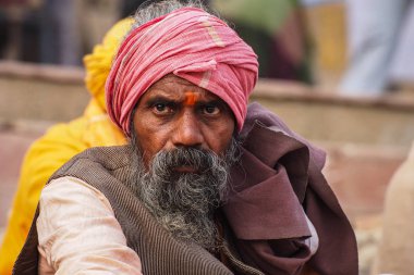 Varanasi, India - Dec 23, 2019: Sadhu at the ghats in Varanasi in India