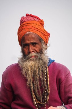 Varanasi, India - Dec 23, 2019: Sadhu at the ghats in Varanasi in India