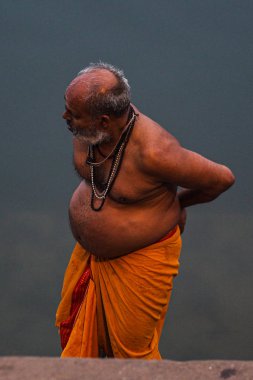 Varanasi, India - Dec 26, 2019: Hindu taking ritual bath in the river Ganga