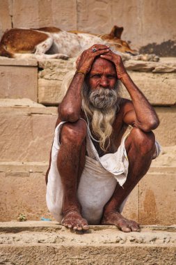 Varanasi, India - Dec 23, 2019: Sadhu at the ghats in Varanasi in India