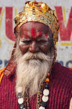 Varanasi, India - Dec 23, 2019: Sadhu at the ghats in Varanasi in India