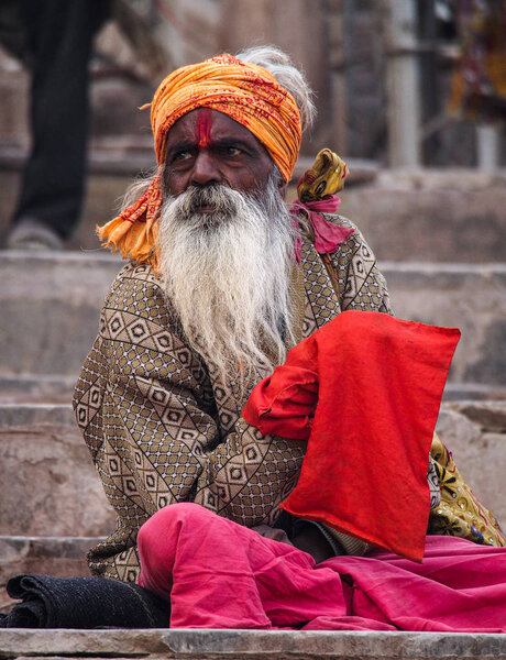 Varanasi, India - Dec 23, 2019: Sadhu at the ghats in Varanasi in India