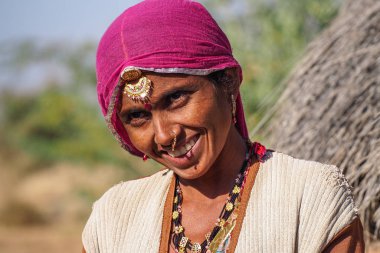 Jaisalmer, India - Jan 01, 2020: Rajasthani gypsy woman in traditional attire